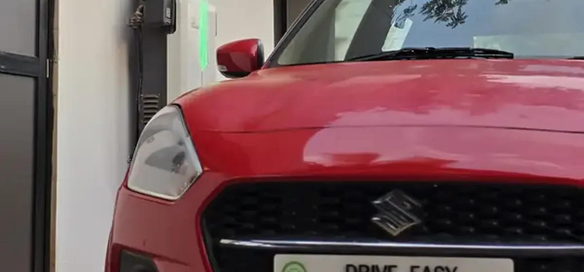 Red Maruti Swift from the Drive Easy fleet, ready for handover in Goa